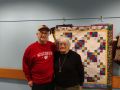 Seniors in front of Quilt at the Senior Center